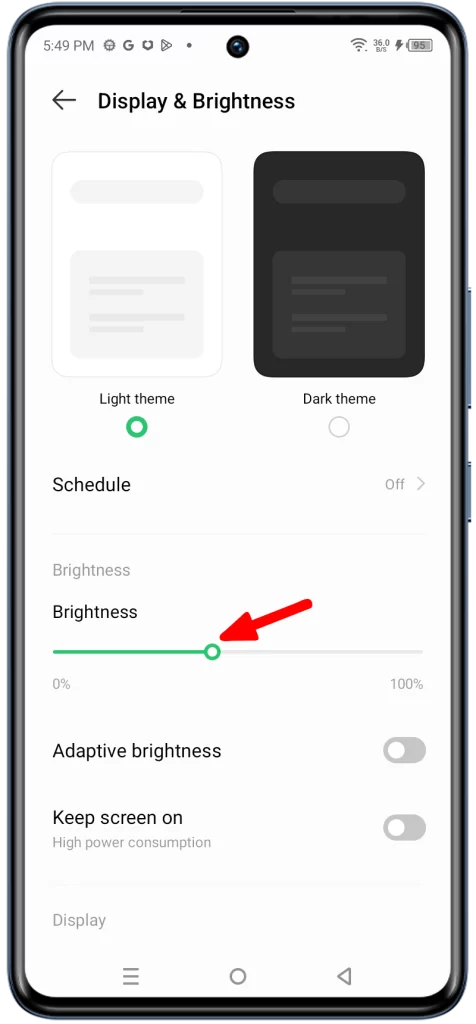 Drag the slider under Brightness to the left. This will reduce the brightness of your screen.