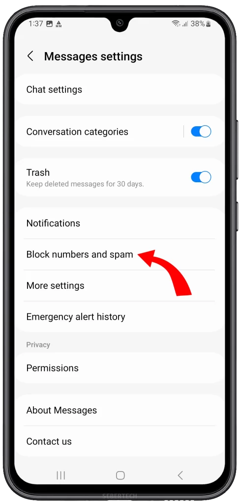 Within the Settings menu, scroll down until you find the "Block numbers and spam" option. Tap on it to access the list of blocked numbers on your device.